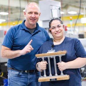 Dave and Esmeralda March Pillar Among Peers Recipient Esmeralda pictured with COO Dave Strand